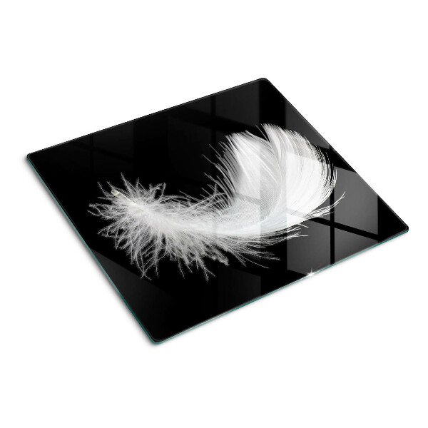 Planche à découper en verre Plume sur fond noir