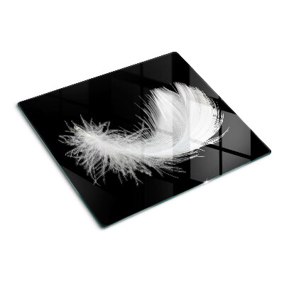 Planche à découper en verre Plume sur fond noir