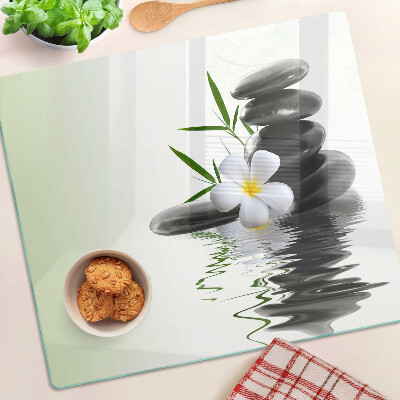 Planche à découper verre Fleurs et pierres sur l'eau