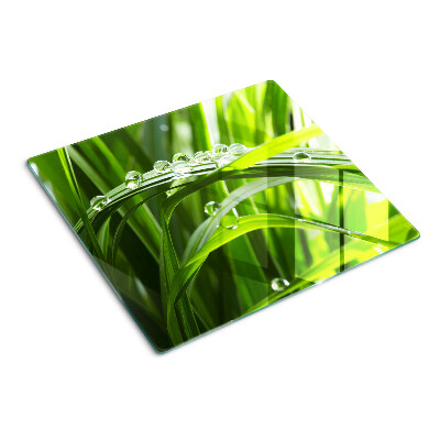 Planche à découper en verre Gouttes d'eau sur l'herbe