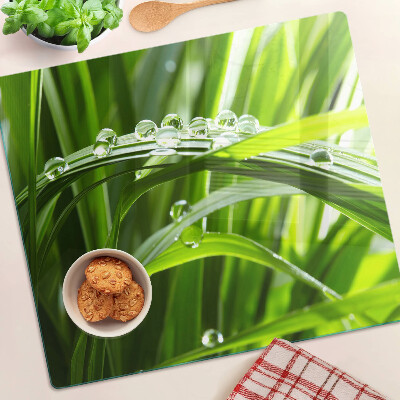Planche à découper en verre Gouttes d'eau sur l'herbe