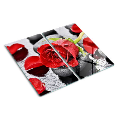 Planche à découper en verre Rose sur pierres avec gouttes d'eau