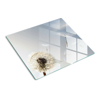 Planche à découper verre Pissenlits en arrière-plan de la fenêtre