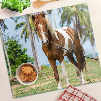 Planche à découper verre Un cheval avec des palmiers en arrière-plan