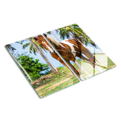 Planche à découper verre Un cheval avec des palmiers en arrière-plan
