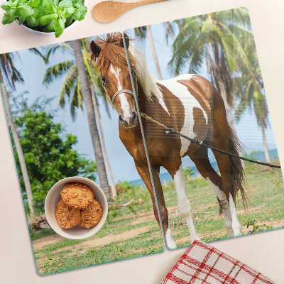Planche à découper verre Un cheval avec des palmiers en arrière-plan