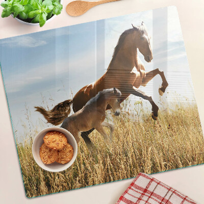 Planche à découper en verre Chevaux dans un pré au soleil
