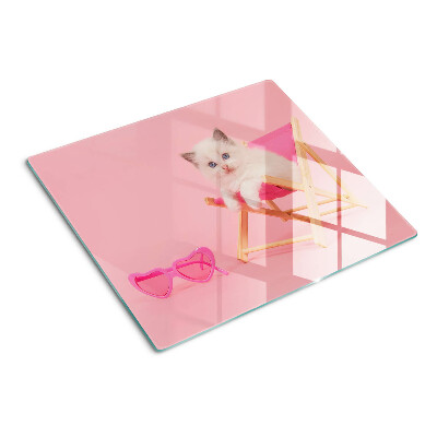 Planche à découper verre Chaton sur une chaise longue sur fond rose