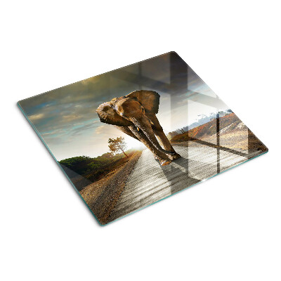 Planche à découper en verre Éléphant sur la route au coucher du soleil