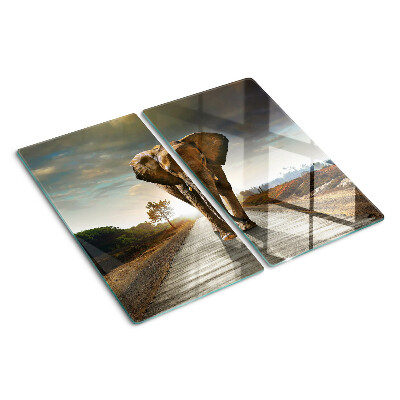 Planche à découper en verre Éléphant sur la route au coucher du soleil