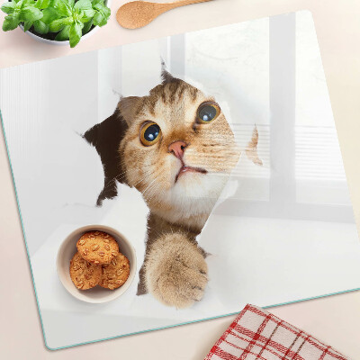 Planche à découper en verre Un chat regardant à travers un trou dans le mur