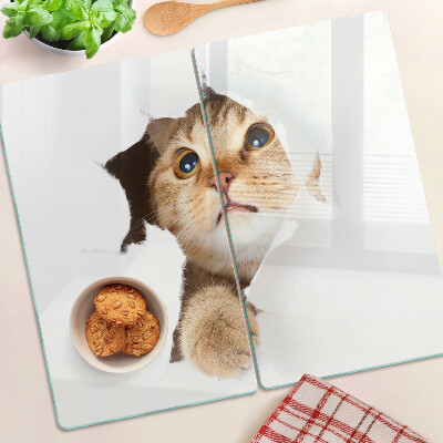 Planche à découper en verre Un chat regardant à travers un trou dans le mur