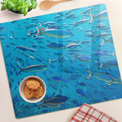 Planche à découper verre Un banc de poissons dans une eau claire
