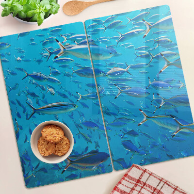 Planche à découper verre Un banc de poissons dans une eau claire