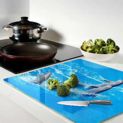 Planche à découper en verre Dauphins sautant par-dessus les vagues