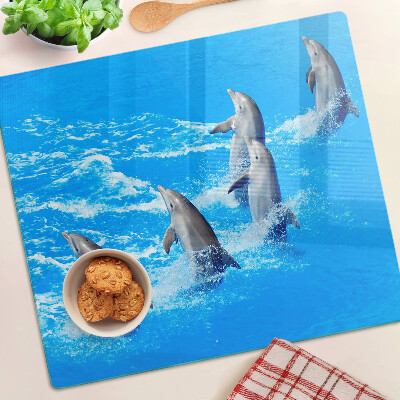 Planche à découper en verre Dauphins sautant par-dessus les vagues