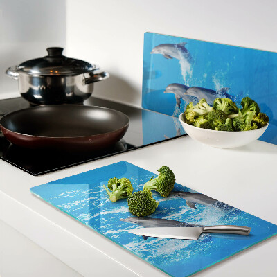 Planche à découper en verre Dauphins sautant par-dessus les vagues
