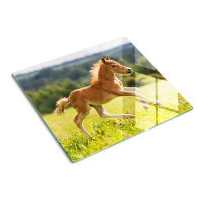 Planche à découper en verre Poulain dans le pré