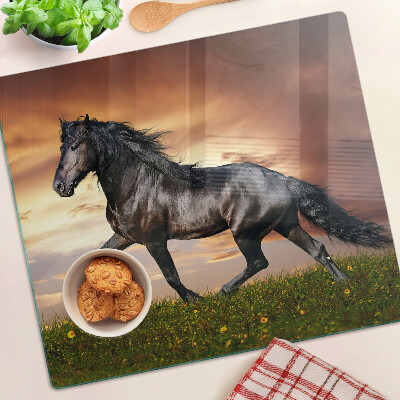 Planche à découper en verre Un cheval sur fond de soleil couchant