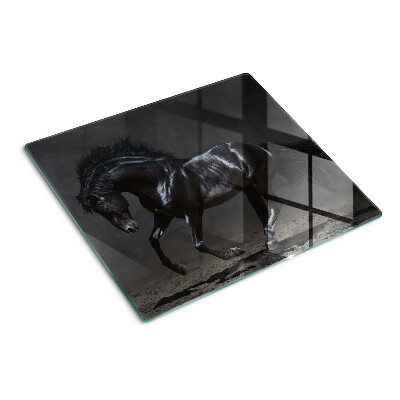 Planche à découper verre Le cheval noir est en mouvement