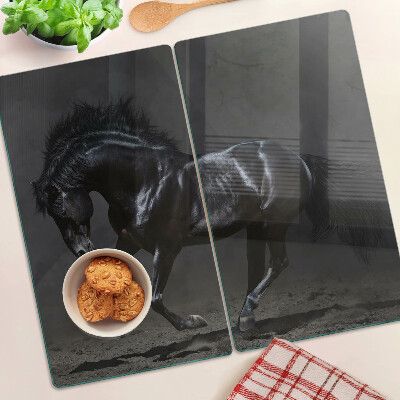 Planche à découper verre Le cheval noir est en mouvement