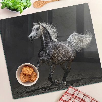 Planche à découper en verre Un cheval tacheté en fuite