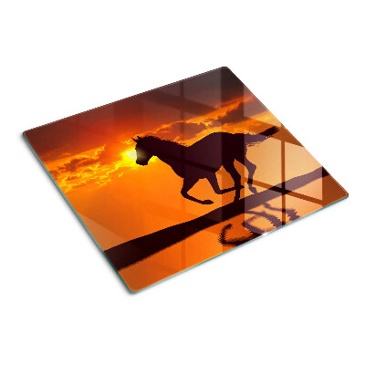 Planche à découper verre Un cheval sur fond de soleil couchant