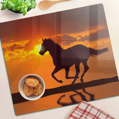 Planche à découper verre Un cheval sur fond de soleil couchant