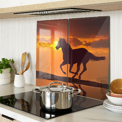 Planche à découper verre Un cheval sur fond de soleil couchant