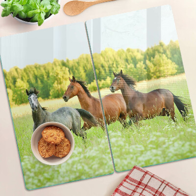 Planche à découper verre Une rencontre de chevaux dans le champ