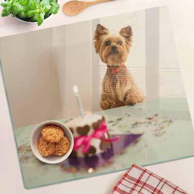 Planche à découper en verre Chien à table avec un gâteau