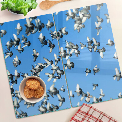 Planche à découper verre Pigeons volant dans le ciel