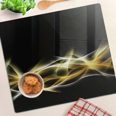 Planche à découper en verre Une vague de lumière aux nuances d'or