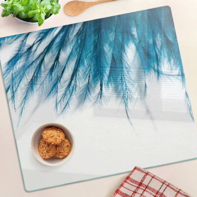 Planche à découper en verre Plumes bleues sur fond blanc