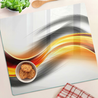 Planche à découper verre Vagues en orange et noir