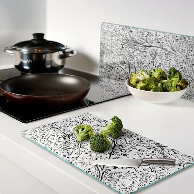Planche à découper verre Un motif végétal aux branches délicates