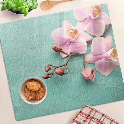 Planche à découper en verre Orchidées sur fond bleu
