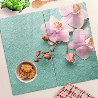 Planche à découper en verre Orchidées sur fond bleu
