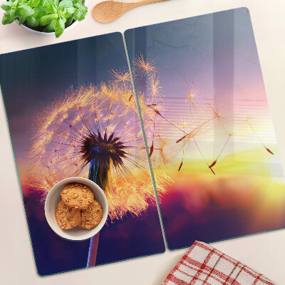 Planche à découper verre Pissenlits contre le coucher du soleil