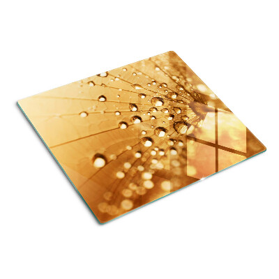 Planche à découper en verre Gouttes d'eau sur un pissenlit