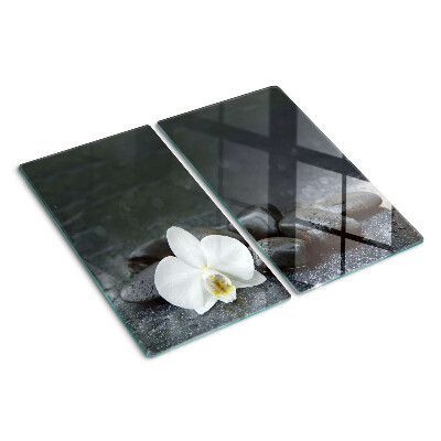 Planche à découper en verre Fleur d'orchidée sur pierres