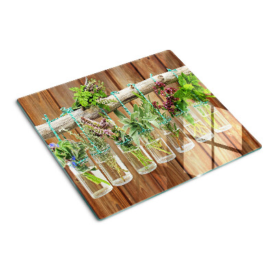 Planche à découper en verre Herbes en pots sur fond de bois