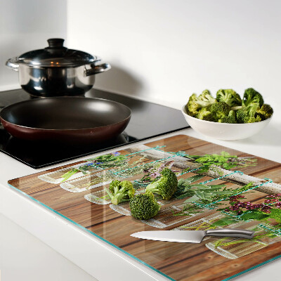 Planche à découper en verre Herbes en pots sur fond de bois