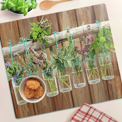 Planche à découper en verre Herbes en pots sur fond de bois
