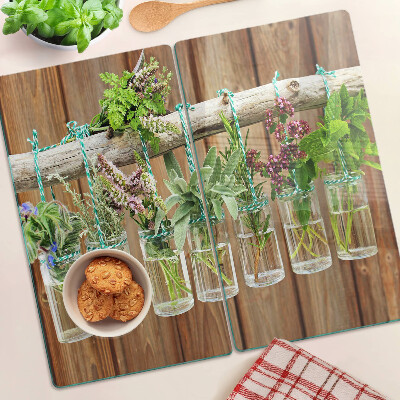 Planche à découper en verre Herbes en pots sur fond de bois
