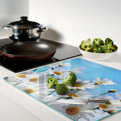 Planche à découper en verre Fleurs de marguerite sur fond bleu