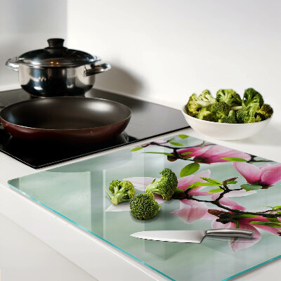 Planche à découper en verre Fleurs de magnolia sur fond de verdure