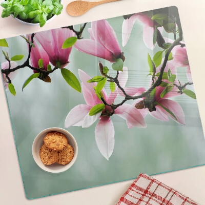 Planche à découper en verre Fleurs de magnolia sur fond de verdure
