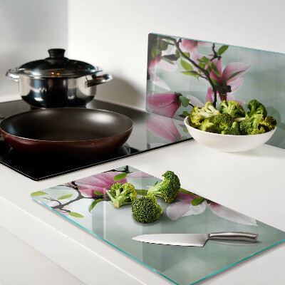 Planche à découper en verre Fleurs de magnolia sur fond de verdure