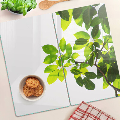 Planche à découper verre Feuilles contre un ciel lumineux